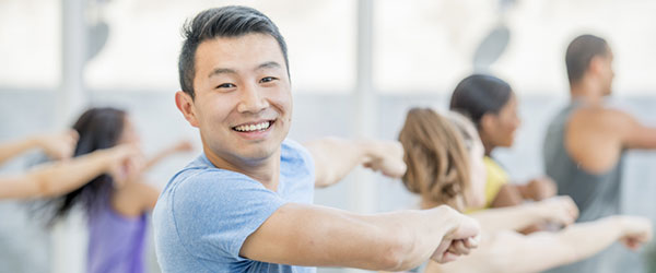 man exercising in a dance class